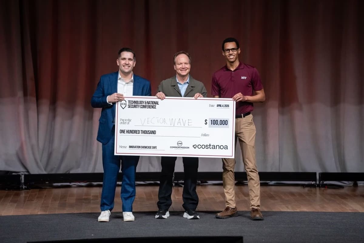 Dr. Ronald Davis III and Ben Taylor receiving a check from J2 Ventures and Coalition Ventures